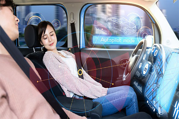 Young woman sleeping in autonomous car.