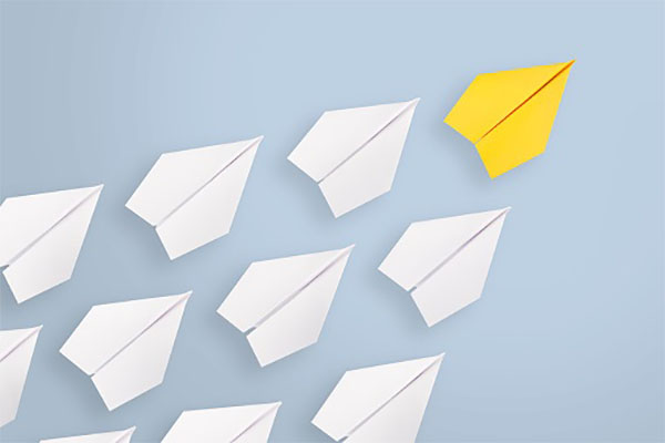 Leadership concepts with yellow paper airplane leading among white Ethics In AI Awareness And AI Autonomous Cars 1