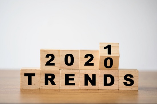 flipping 2020 to 2021 trends print screen on wooden block cubes. New idea business fashion popular and relevant topics.