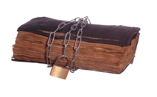 old prayer book with padlock and chain